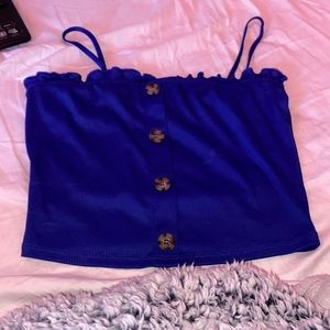 This is a cute top with buttons down the middle!